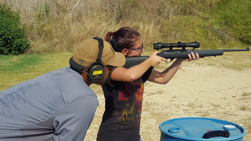 Ken Lewis formally with National Protective Services Institute also known as NPSI Training and currently with Prevent Prepare Protect Training and Consulting instructing a student during a Basic Rifle Class.